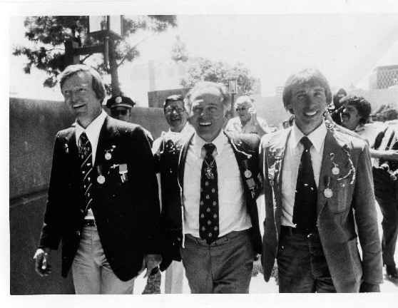 Ben Abruzzo, Maxie Anderson, and Larry Newman walk together in blazers, all three grinning, after completing the first Atlantic crossing by balloon in 1978